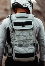 Load image into Gallery viewer, Rider wearing ghost vest with the back of the vest showing