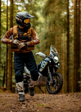 Load image into Gallery viewer, Rider with his bike in the forest wearing the Copper Pack Vest